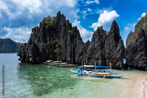 Nice tropical beach with stranded Filipino boats photo