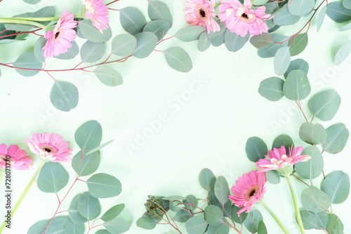 wedding or mothers day backgroundgreen eucaliptus leaves over mint green background photo