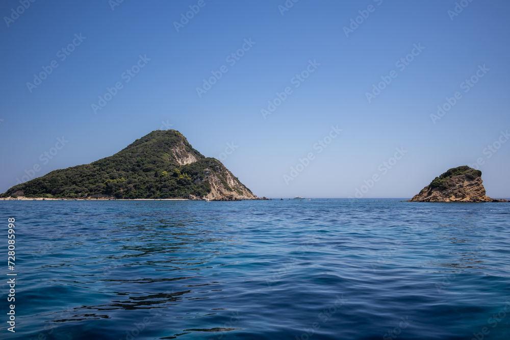 Turtle Island with Ionian Sea in Zakynthos. Beautiful Marathonisi with Blue Water during Summer Day in Greece.