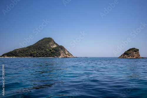 Turtle Island with Ionian Sea in Zakynthos. Beautiful Marathonisi with Blue Water during Summer Day in Greece. © nicolecedik