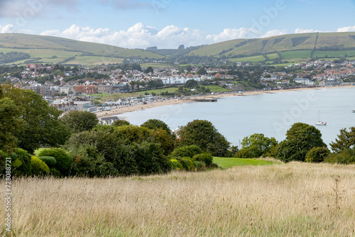 Swanage bay and rolling hills of Ballard down seen from Durlston photo