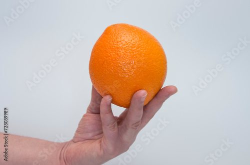 orange hold in a hand