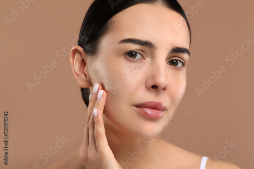 Woman with dry skin on beige background, closeup
