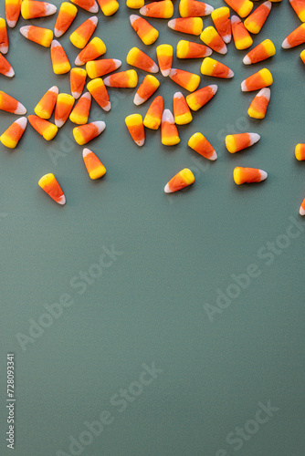 Candy corn on green background photo