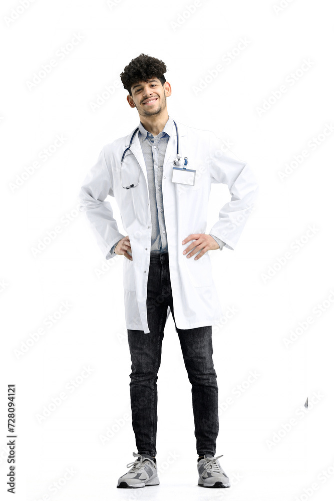 Male doctor, full-length, on a white background, hands on hips Male doctor, full-length, on a white background, hands on hips