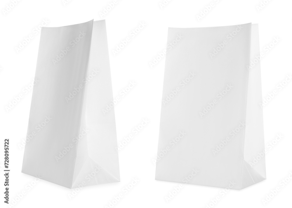 Open white paper bags isolated on white Open white paper bags isolated on white