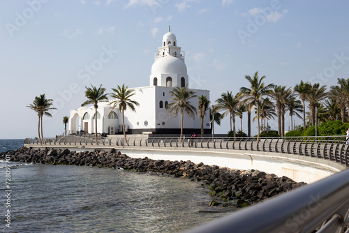 Background for the laptop with a white mosque no the cost of the Red Sea in Jeddah © Kucheryaha