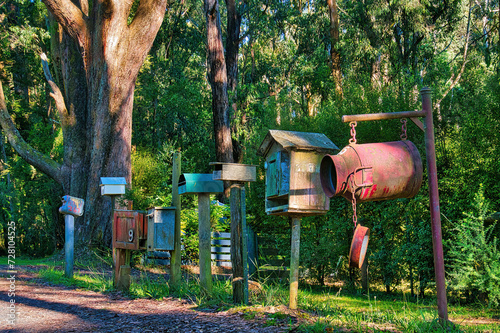 Obraz na plátně Row of individualistic rural letterboxes by the roadside of a country lane in a