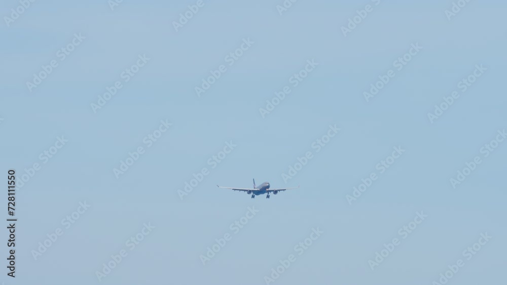 Commerical airplane flying with blue sky and sea background. Concept travel and tourism Commerical airplane flying with blue sky and sea background. Concept travel and tourism