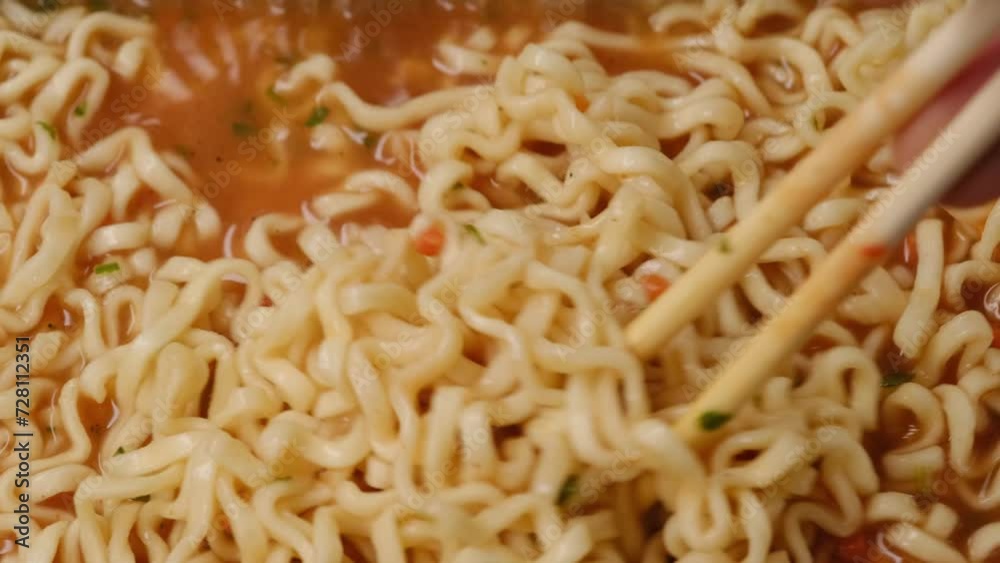cooking instant noodle on plate in macro shot cooking instant noodle on plate in macro shot