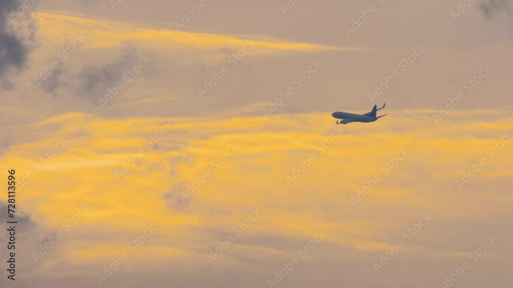 The plane against the blue sunset sky. Aircraft departure. Plane leaving. The setting sun. Sunset The plane against the blue sunset sky. Aircraft departure. Plane leaving. The setting sun. Sunset