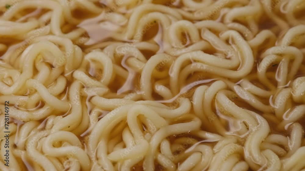 golden tortilla in a wooden plate and Chinese chopsticks. Asian noodles close up golden tortilla in a wooden plate and Chinese chopsticks. Asian noodles close up