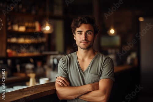 A man standing at a bar counter, ready to order a drink.