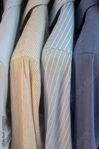 shirts on hangers in clothing store