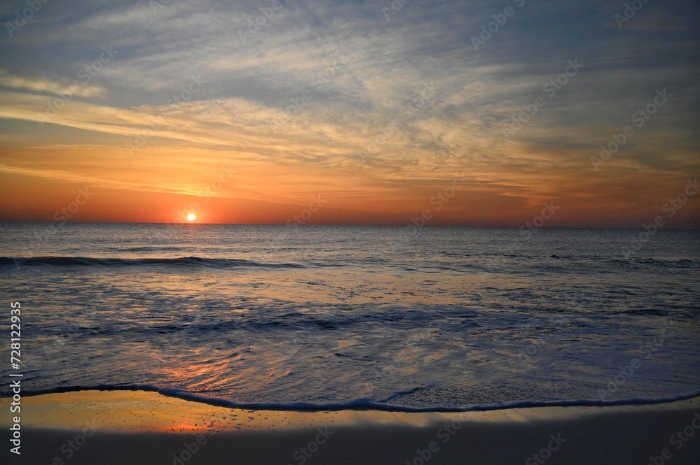 Obraz premium Swirling clouds at daybreak over the Atlantic Ocean
