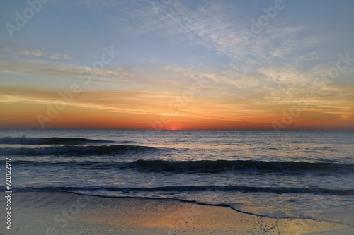 First light before the sun rises over the ocean © Chad