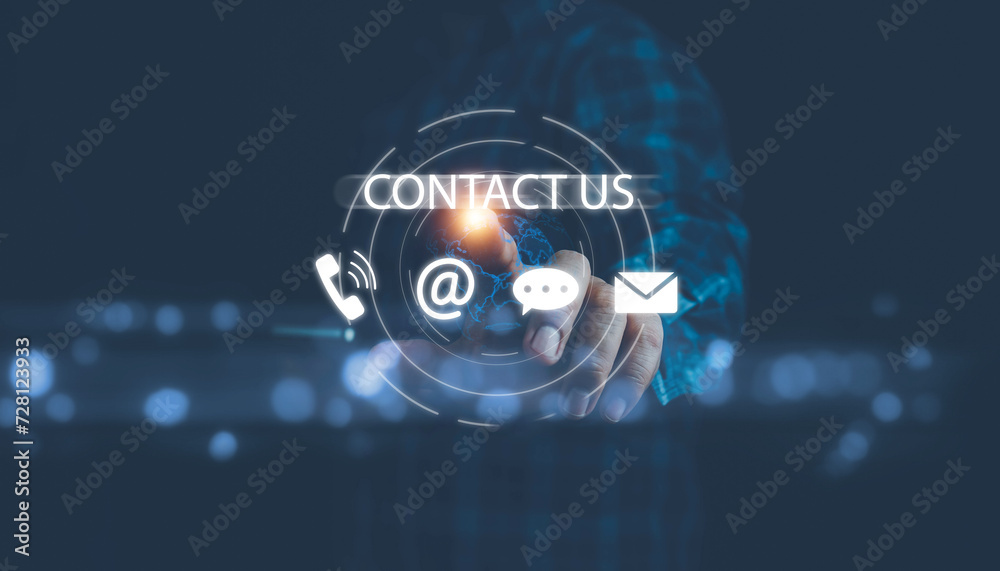 Fototapeta premium Contact us or Customer support hotline, people connect. Businessman touching on virtual screen contact icons (email, address, live chat, telephone). Customer service, helpdesk advice online support.