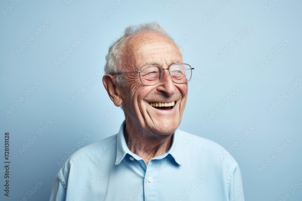 Portrait of a happy senior man with glasses over blue background. Portrait of a happy senior man with glasses over blue background.