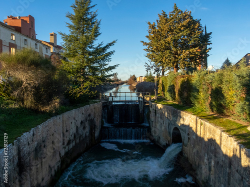 Lock number 33 of the Canal de Castilla in the town of Villamuriel de Cerrato. Palencia, Castile and Leon, Spain. photo