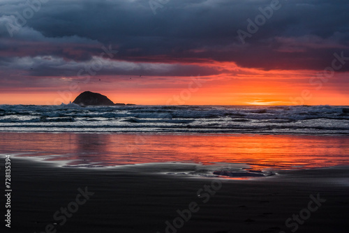 Sunset at the beach with reflection of colorful light