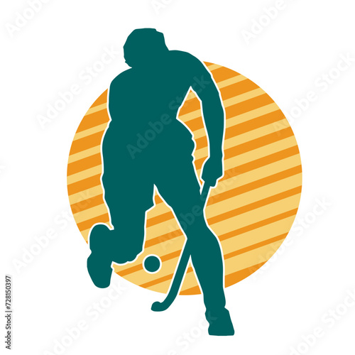 Silhouette of male field hockey athlete in action. Silhouette of a man playing field hockey sport.