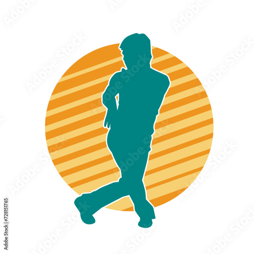 Silhouette of a man in oriental martial art pose. Silhouette of a male in martial art move.