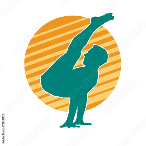 Silhouette of a sporty male in action pose at the gym. Silhouette of a slim man in aerobics workout pose.