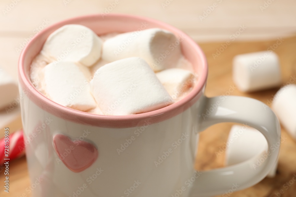 Tasty hot chocolate with marshmallows on table, closeup