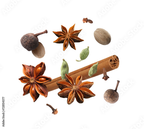 Fototapeta Naklejka Na Ścianę i Meble -  Different aromatic spices falling on white background