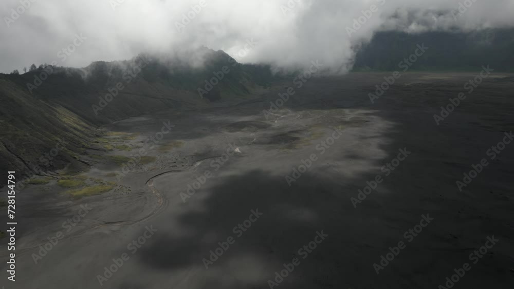 Flyover of volcanic ash caldera at Mt Bromo in Java, Indonesia Flyover of volcanic ash caldera at Mt Bromo in Java, Indonesia