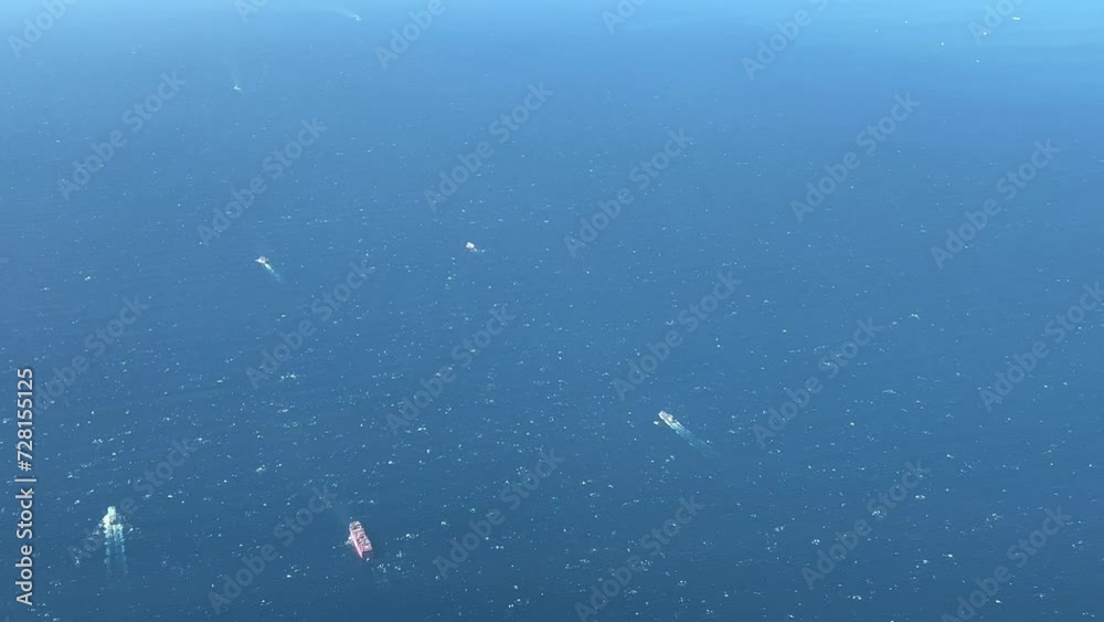 Strait of Gibraltar aerial view with heavy sea traffic. Shot from a jet cockpit. Strait of Gibraltar aerial view with heavy sea traffic. Shot from a jet cockpit.