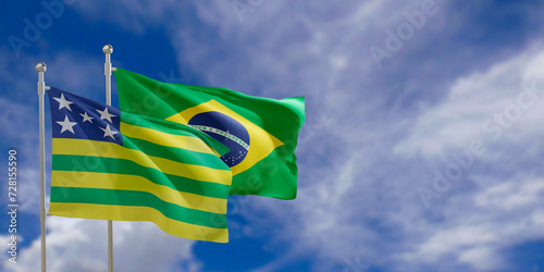 Official flags of the country Brazil and federal state of Goias. Swaying in the wind under the blue sky. 3d rendering photo
