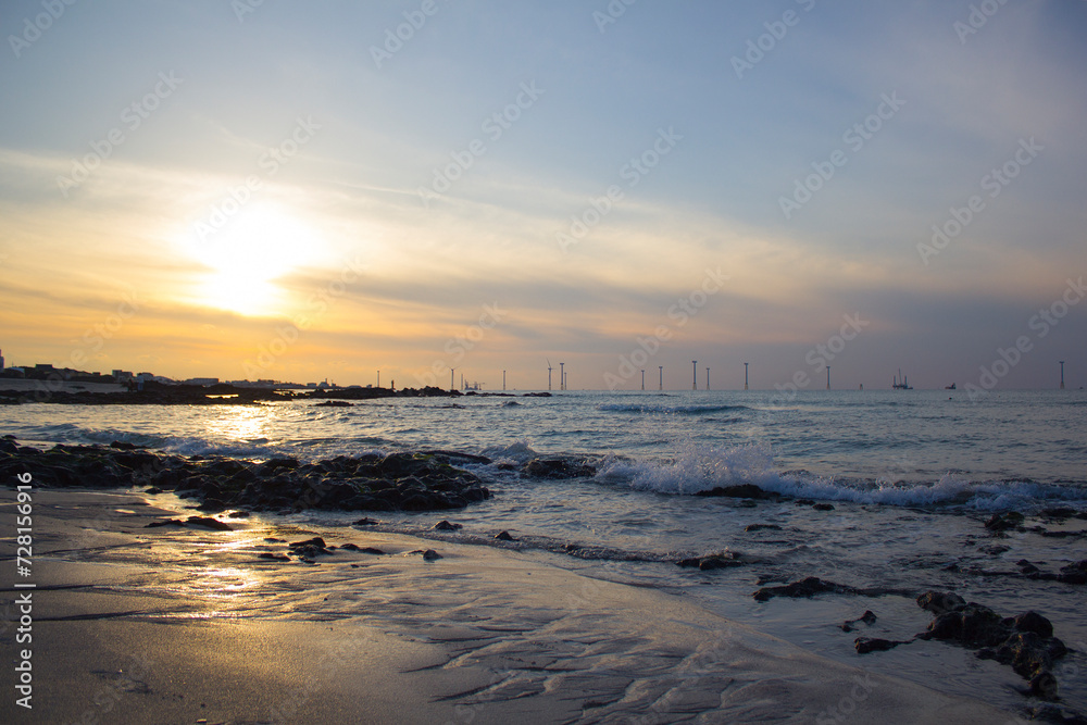 This is the sunset view of Gwakji Beach in Jeju Island. This is the sunset view of Gwakji Beach in Jeju Island.