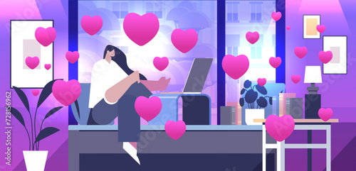 girl in love using laptop social media communication happy valentines day celebration concept living room interior with pink hearts