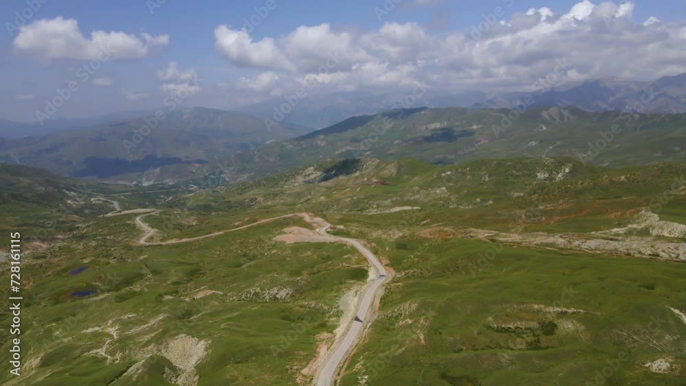 Drone shot flying along a road going through the Caucasus mountains in Azerbaijan in summer. Drone shot flying along a road going through the Caucasus mountains in Azerbaijan in summer.