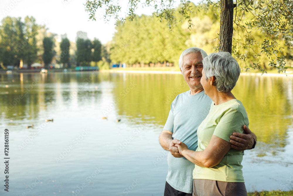 A couple of pensioners near the lake. Golden age. A couple of pensioners near the lake. Golden age.