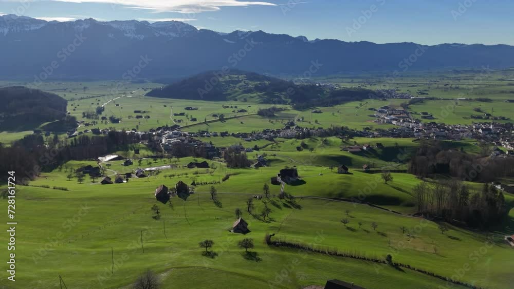 Aerial of small village in Swiss Alps with mountainous background - Rieden, Switzerland Aerial of small village in Swiss Alps with mountainous background - Rieden, Switzerland