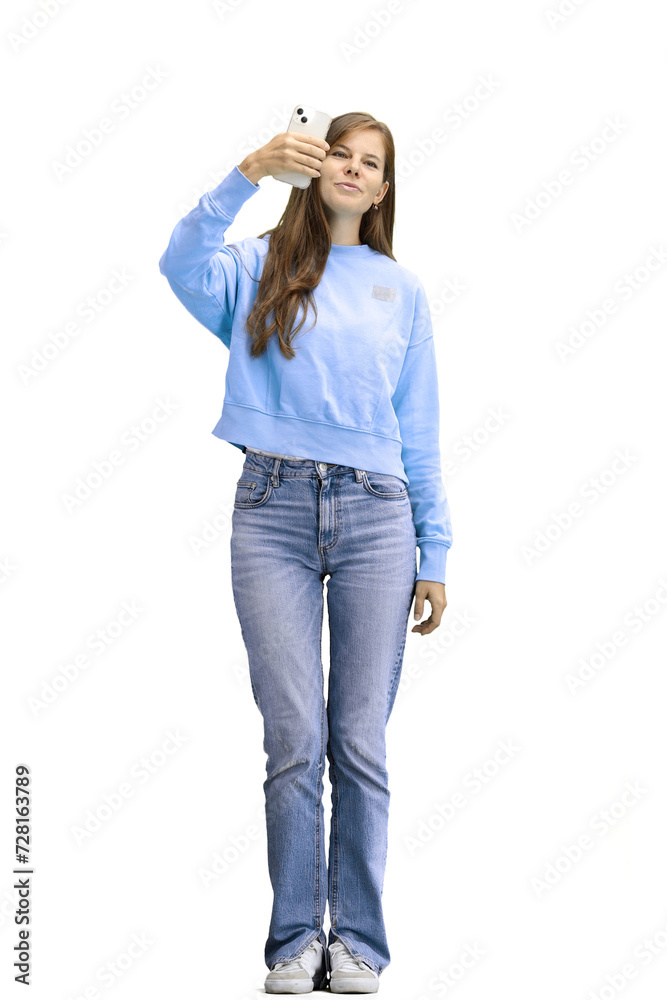 A woman, full-length, on a white background, with a phone A woman, full-length, on a white background, with a phone