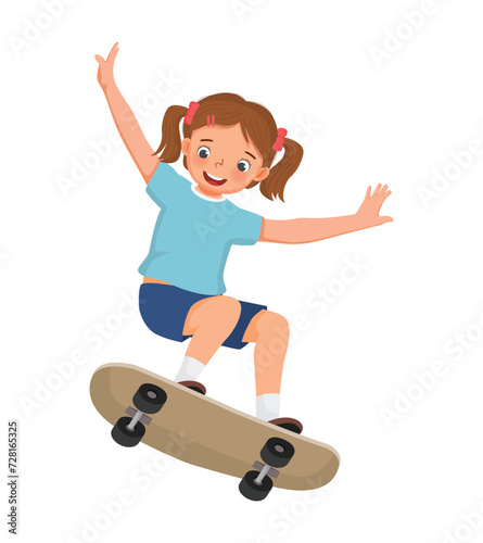 Cute little girl playing skateboard 