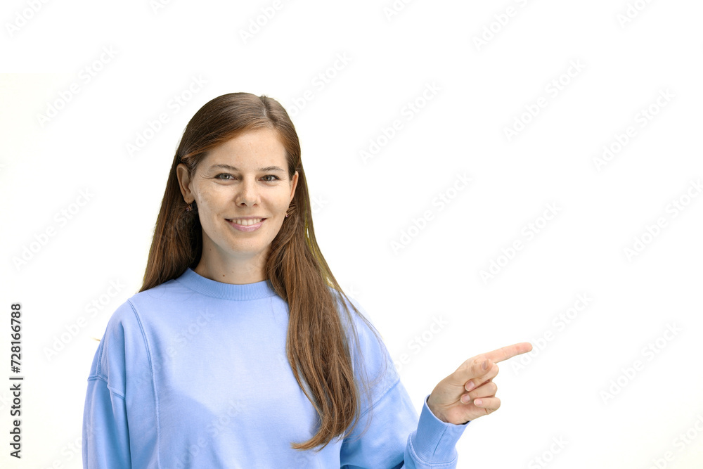 A woman, close-up, on a white background, points to the side A woman, close-up, on a white background, points to the side
