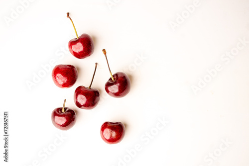 top view of cherries. Sweet cherries. Fresh cherries. Ripe cherries on white background