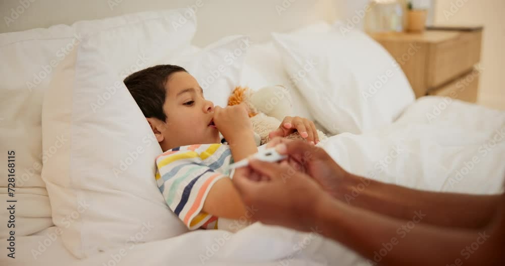 Bedroom, virus and parent with boy, thermometer and temperature with disease and recovery. Family, person and child with flu and cold with fever and comfort with care, support and home with a kid Bedroom, virus and parent with boy, thermometer and temperature with disease and recovery. Family, person and child with flu and cold with fever and comfort with care, support and home with a kid