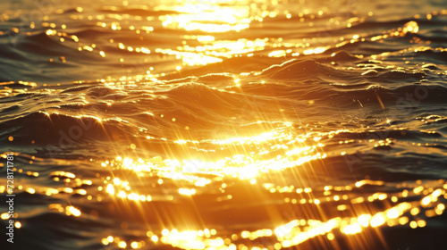 A stunning closeup of the oceans surface lit by the warm embrace of the suns golden hues.