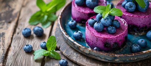 Delicious Blueberry Cheese Cakes Plated on a Rustic Wooden Table