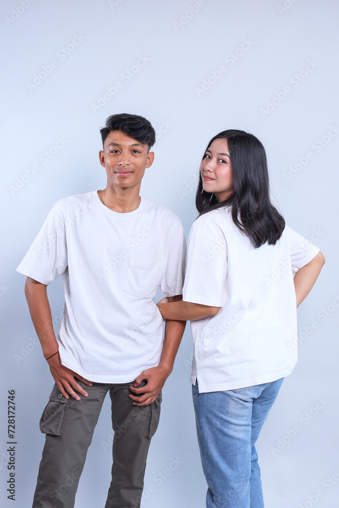 Asian man and woman couple wearing white t-shirt. Front and back t-shirt mockup for couple. Asian man and woman couple wearing white t-shirt. Front and back t-shirt mockup for couple.