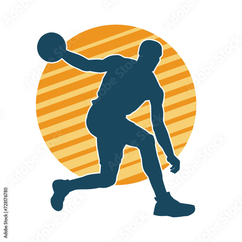 Silhouette of a basket ball player in action pose. Silhouette of a male basket ball athlete.