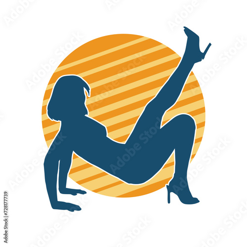 Silhouette of a sexy female doing seductive dance