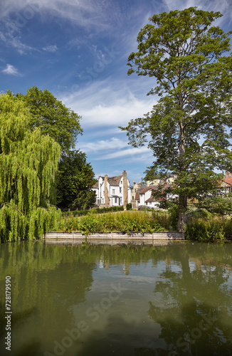 View of residential cottages from the river Cam in Cambridge. Cambridgeshire. United Kingdom