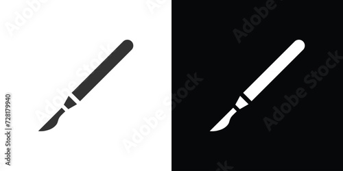 surgical blade on black and white