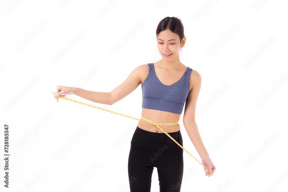 Portrait beautiful young asian woman measure tape with waist for weightloss with satisfied isolated white background, female in sportswear slimming shape with workout, sport and health care concept. Portrait beautiful young asian woman measure tape with waist for weightloss with satisfied isolated white background, female in sportswear slimming shape with workout, sport and health care concept.